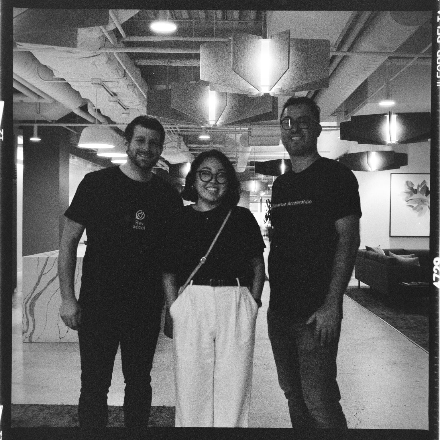 Black and white photo of three team members