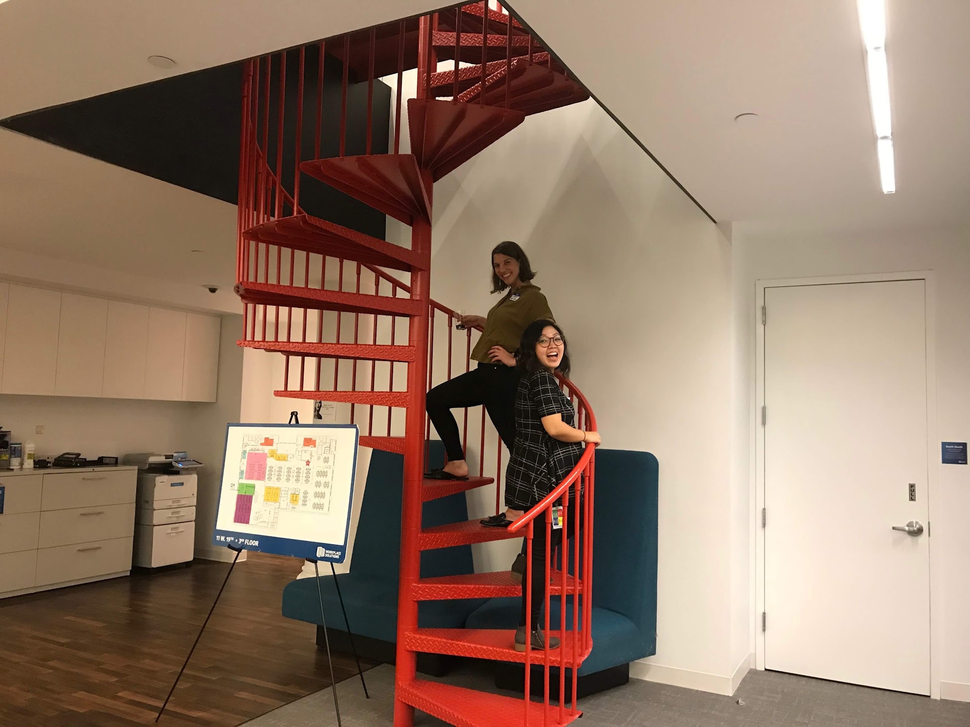 Team photo on a red staircase